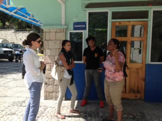 Pictured, Dyer, Gardner, and Roche speak with Naomie Beaujour who works with J/P HRO.