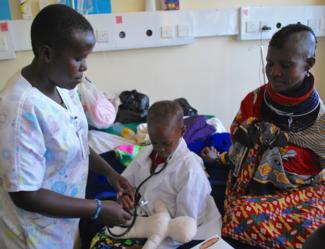 Engaging in medical play with a  young boy